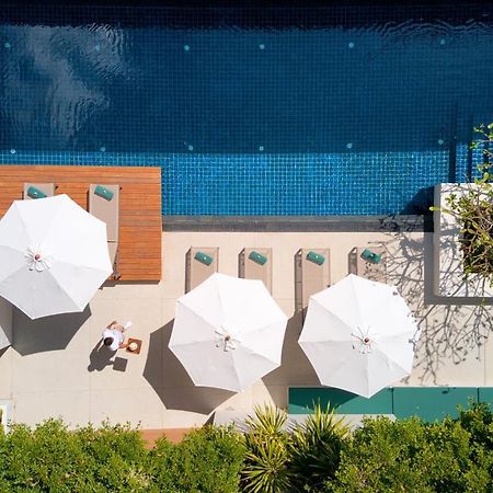 Outrigger Surin Beach Resort - Sha Extra Plus Bagian luar foto The pool at the Beverly Hills Hotel