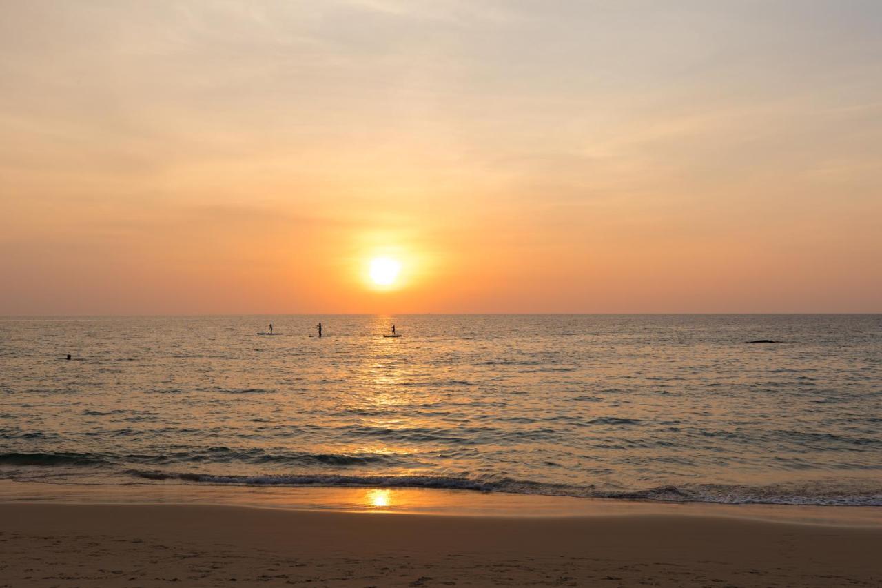 Outrigger Surin Beach Resort - Sha Extra Plus Bagian luar foto Sunset at the beach